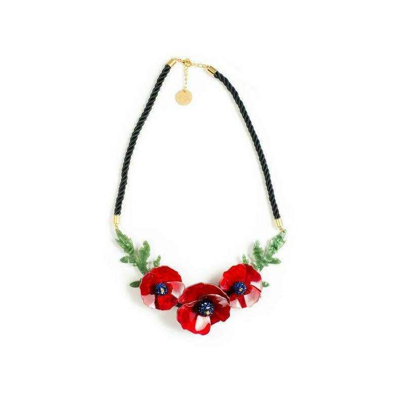 Poppy flower necklace with red blooms, blue centers, and green leaves on black cord