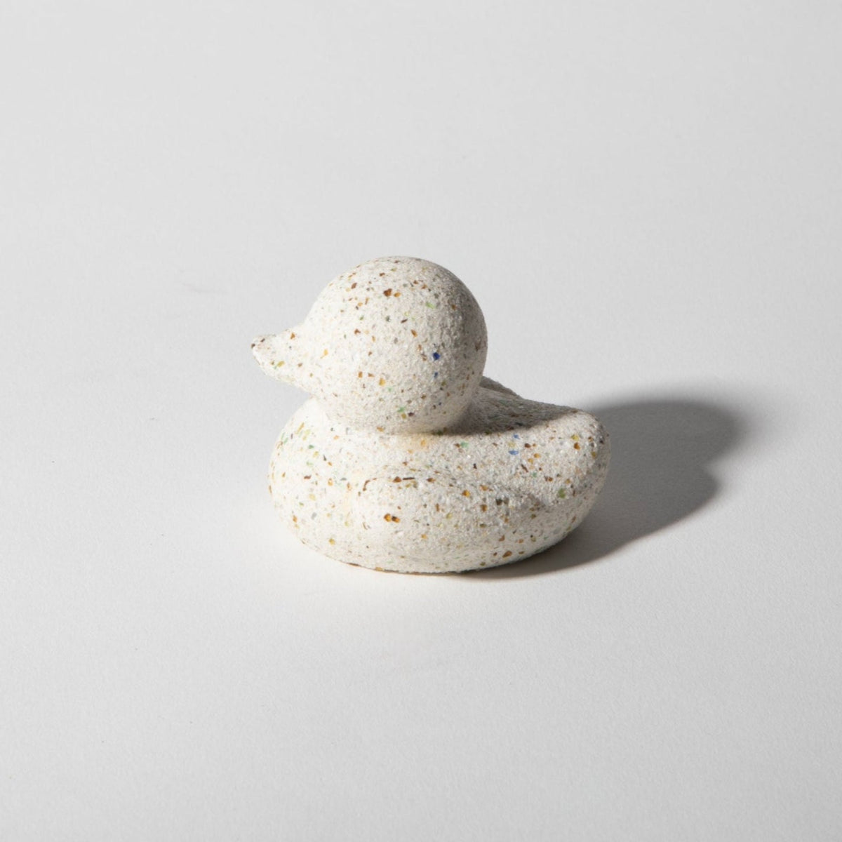Mini terrazzo rubber duck figurine, speckled white with blue and orange flecks