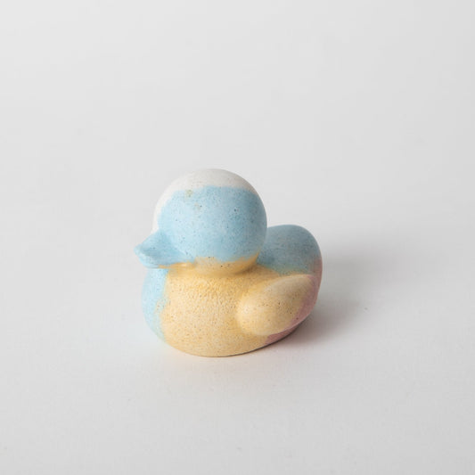 Mini rubber duck figure, speckled blue top and yellow body with curved beak