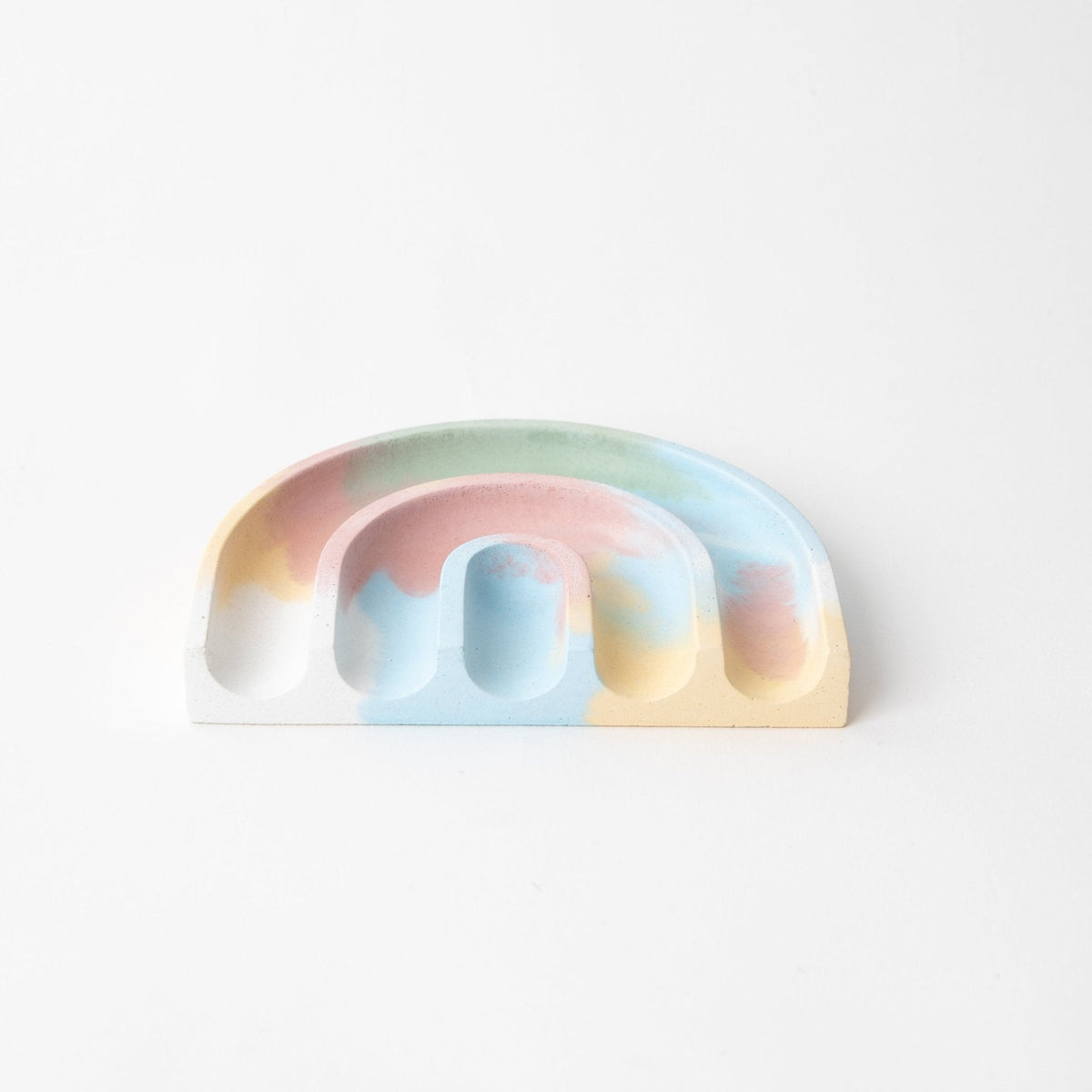 Pastel rainbow sponge rest with curved base and open slot for soap sponge