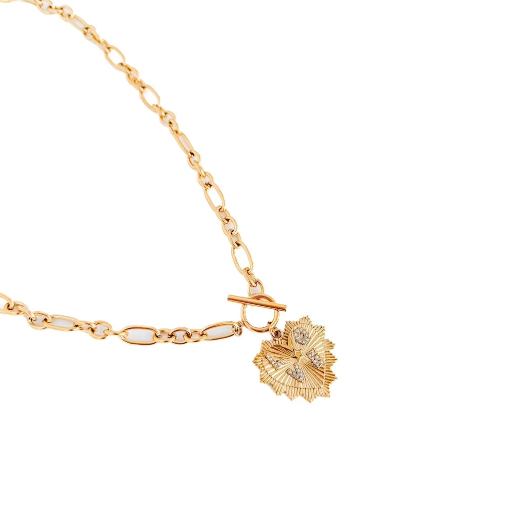 Gold-tone toggle clasp necklace with sunburst heart pendant on a link chain