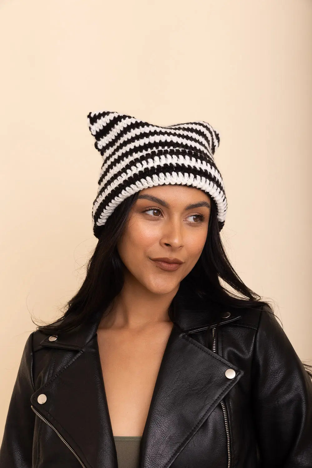 Black and white striped cat-ear crochet beanie with ribbed cuff