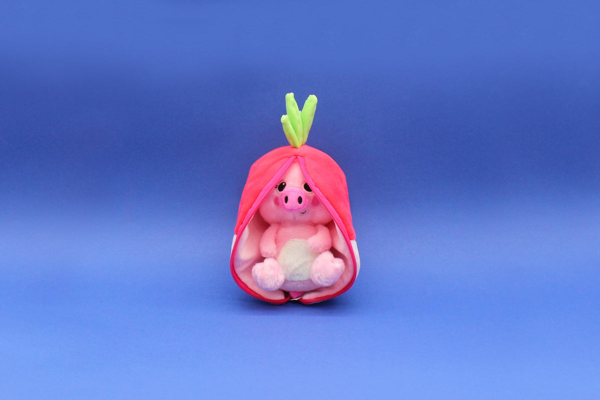 Small plush radish pod with green leaves, pink pig face inside