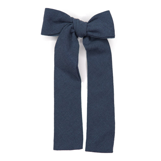 Navy textured lady hair bow with tied center knot and long tails