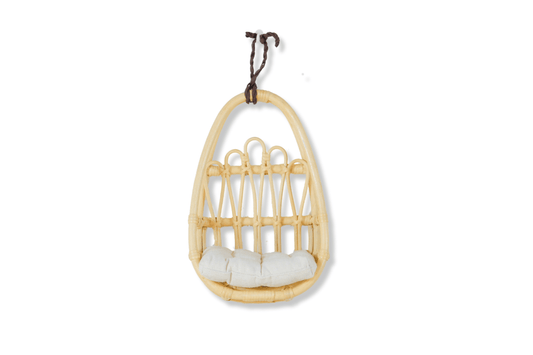 Natural rattan doll wall chair with a white seat cushion and hanging cord