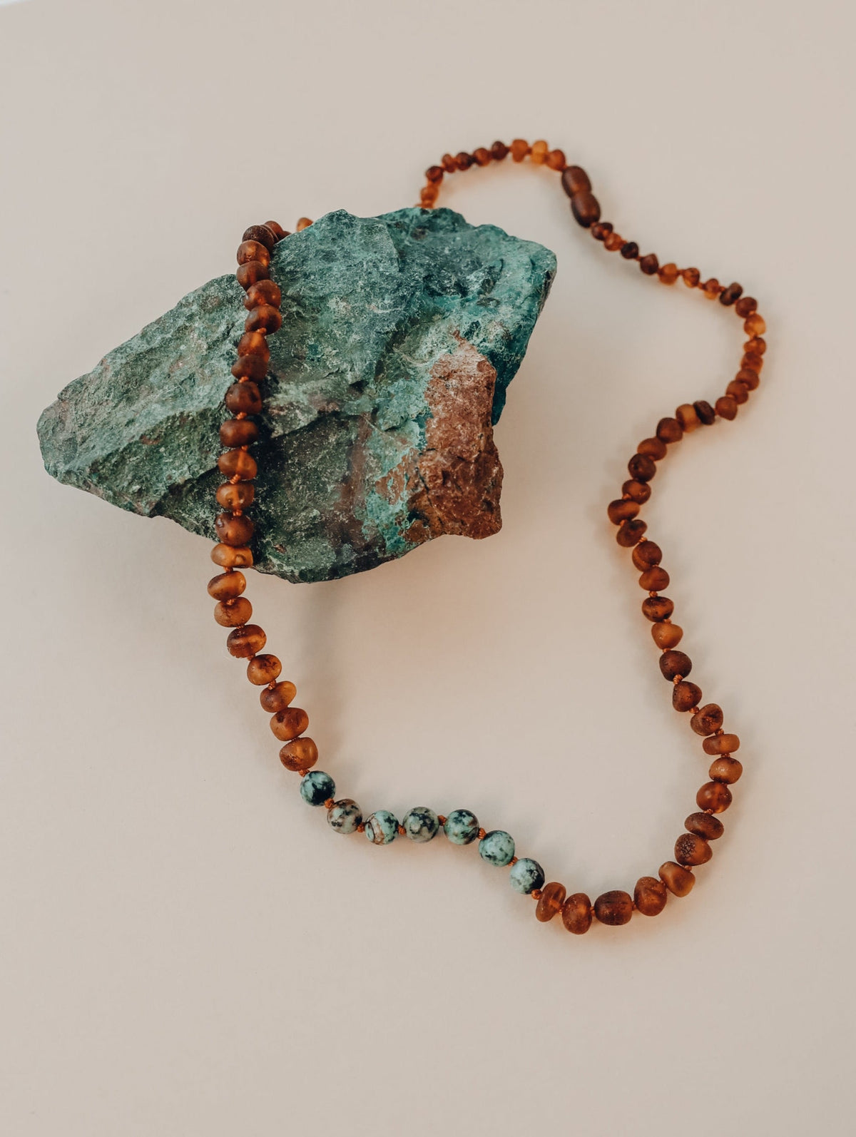 Raw jasper pendant beaded necklace with red-brown amber and turquoise accents