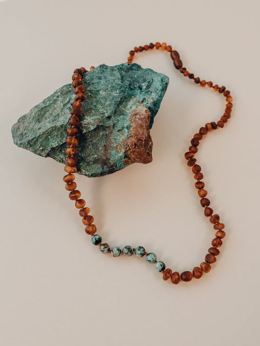 Raw jasper pendant beaded necklace with red-brown amber and turquoise accents