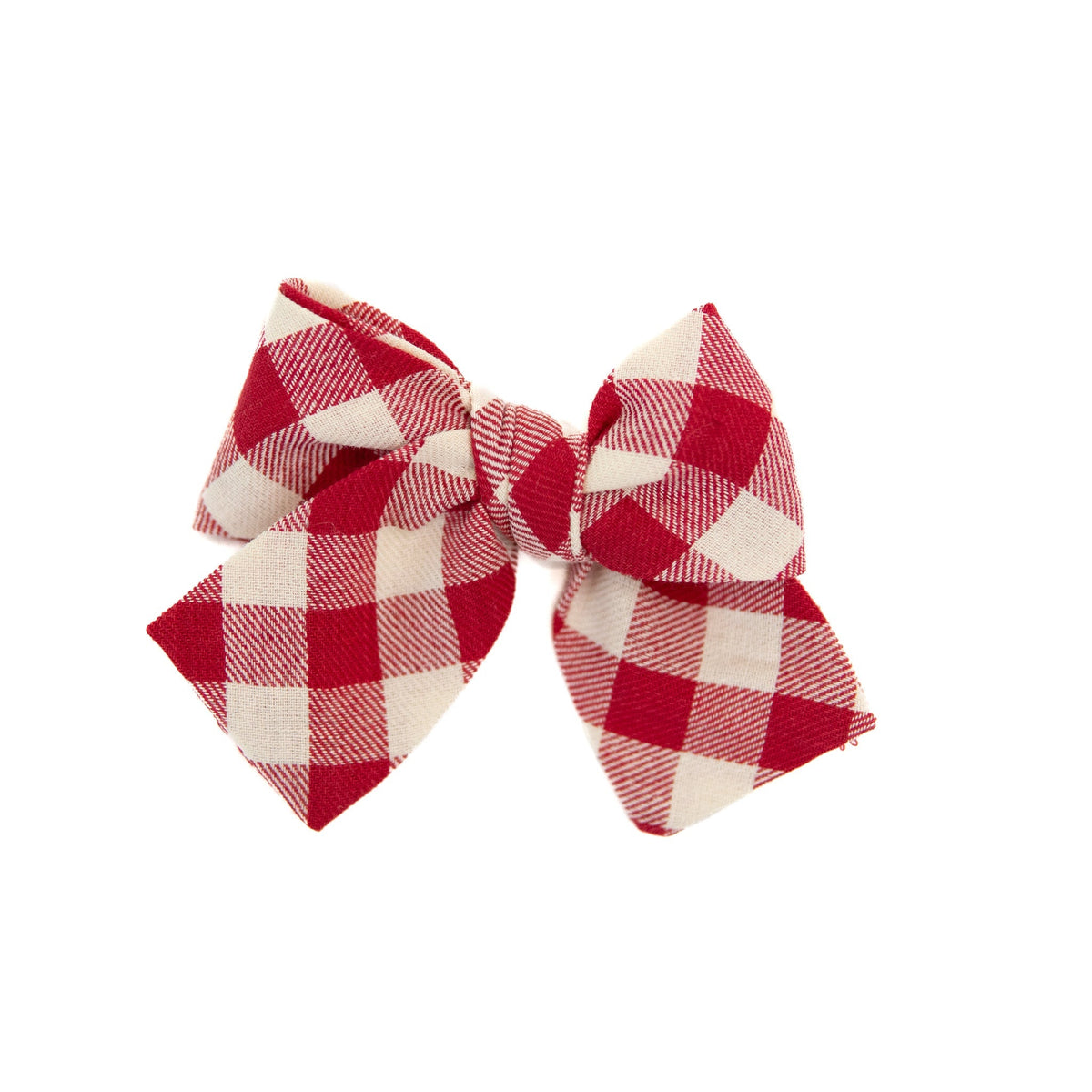 Petite hair bow with red and cream buffalo-check fabric, tied center