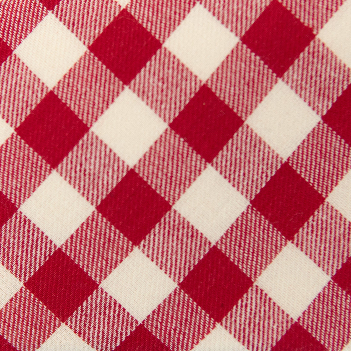 Red-and-cream plaid necktie fabric close-up with textured weave