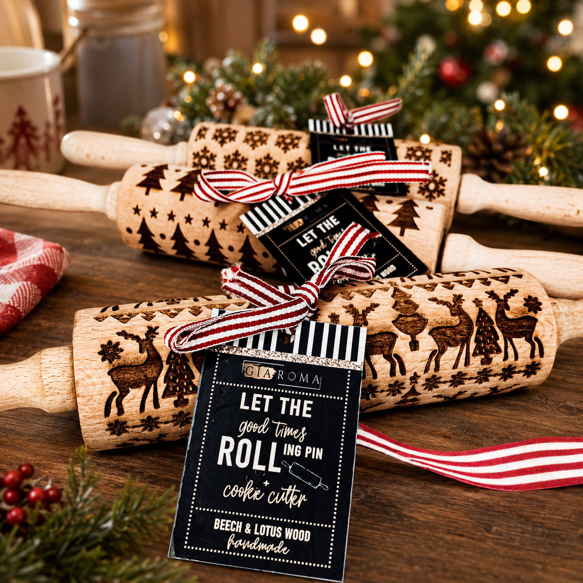 Wooden Christmas rolling pins with embossed stars and trees, each with a “Let the Roll” tag
