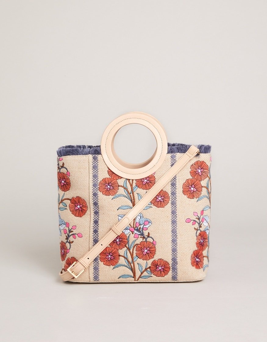Embroidered floral tote with round handle, blue-and-cream stripes, and beige base