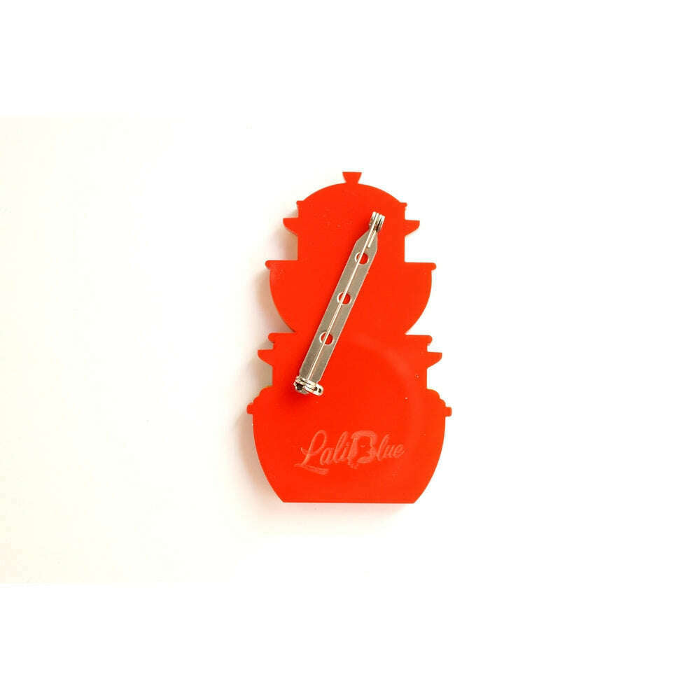 Retro container brooch back with safety pin clasp on orange backing