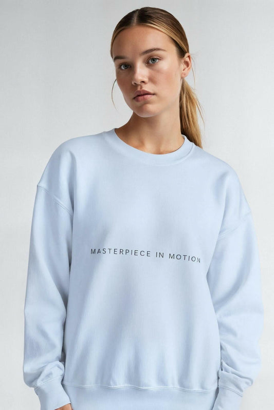 Light blue crewneck sweatshirt with 'MASTERPIECE IN MOTION' chest print