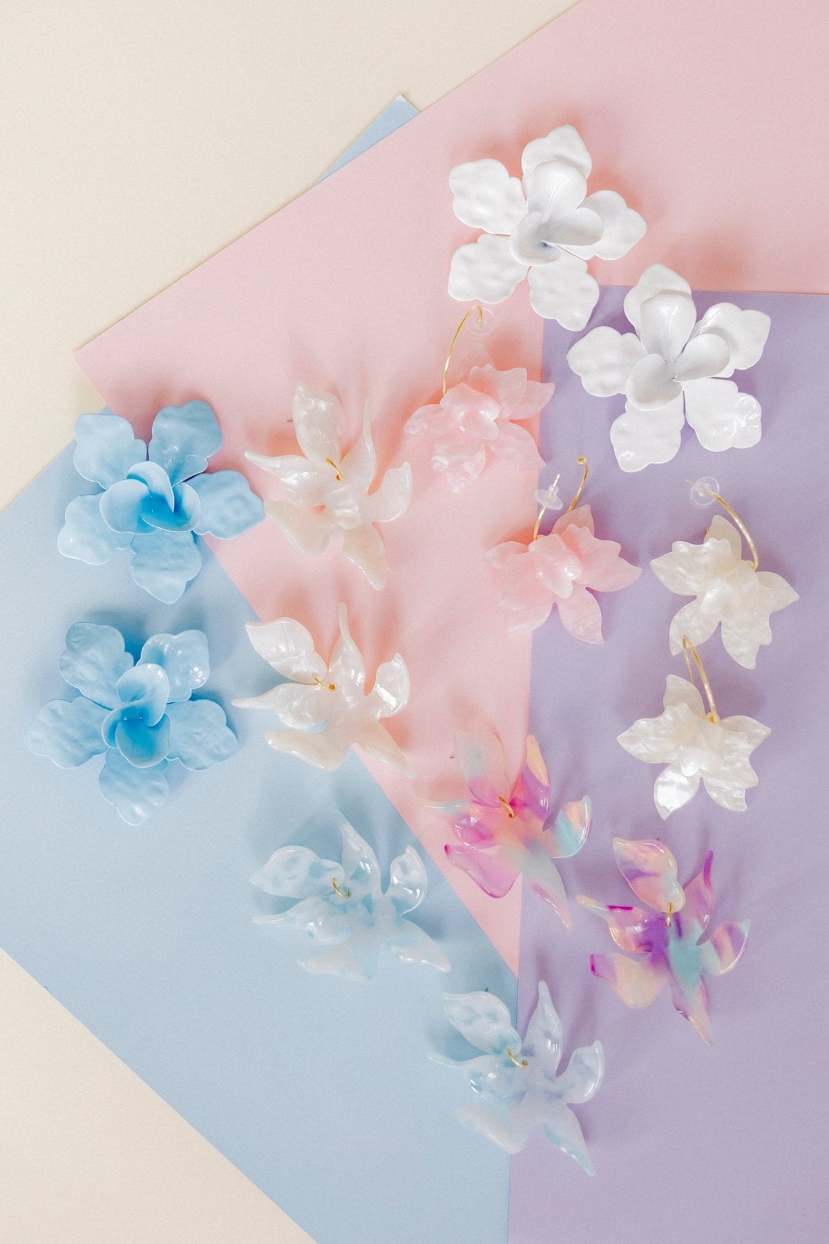 Pastel floral statement earrings with layered blossoms and gold-tone accents