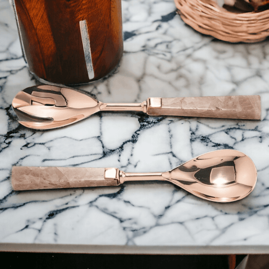 Pair of rose quartz serving spoons with rose-gold scoops and pink stone handles