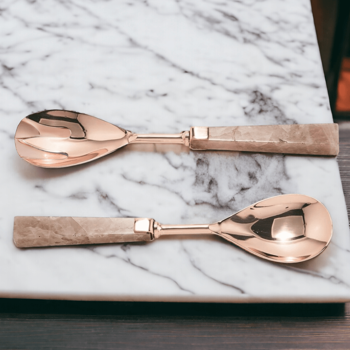 Rose quartz serving spoons with rose-gold metal scoops and matching pink stone handles