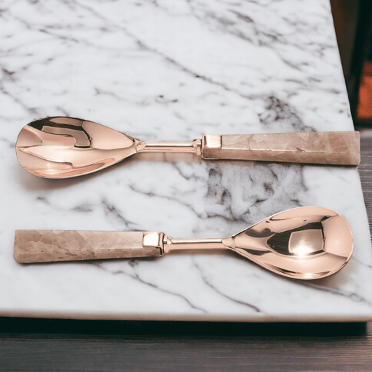 Rose quartz serving spoons with rose-gold metal scoops and matching pink stone handles