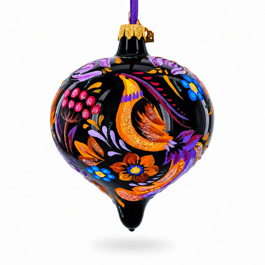 Black glass onion-shaped Christmas ornament with colorful floral and bird artwork, hanging loop