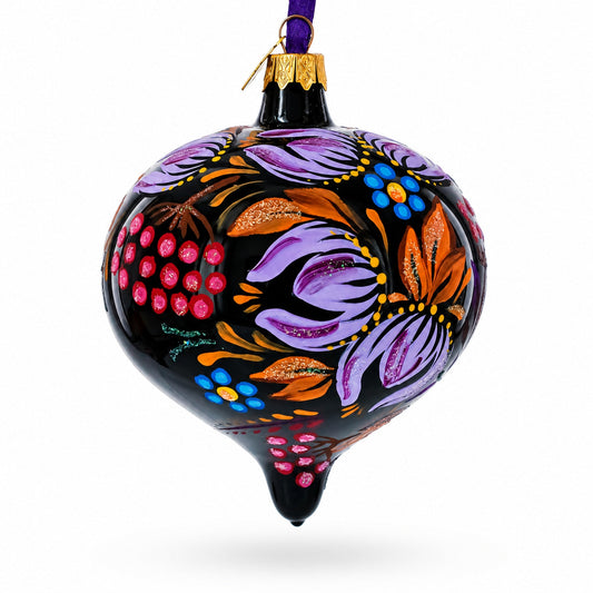 Black glass onion Christmas ornament with purple and orange floral patterns, pink dot accents, loop