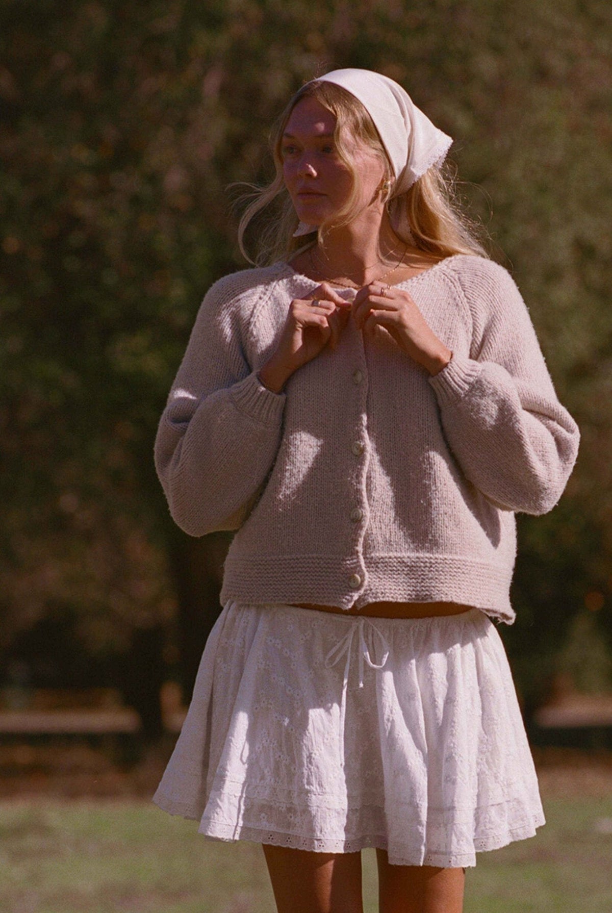 Oatmeal knit cardigan sweater with button-front and long sleeves, ribbed cuffs