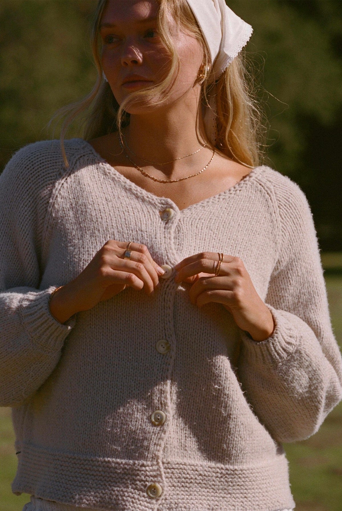 Oatmeal knit button-front cardigan sweater with V-neckline and textured knit