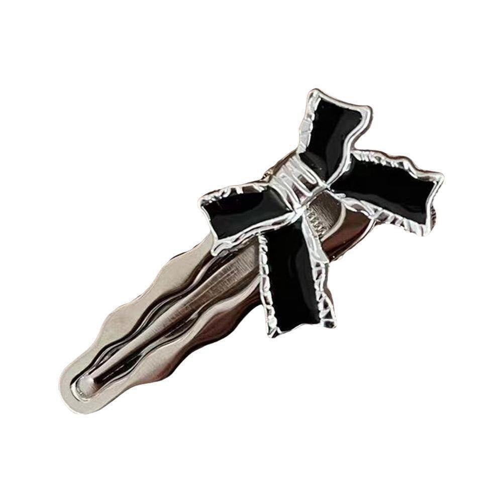 Silver-tone and black enamel bow hair clip with hinge barrette