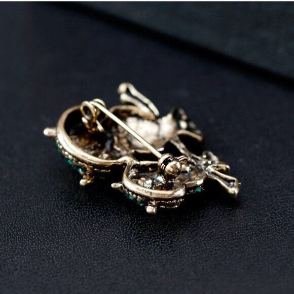 Rhinestone owl brooch clasp and pin on gold-tone backing with owl details