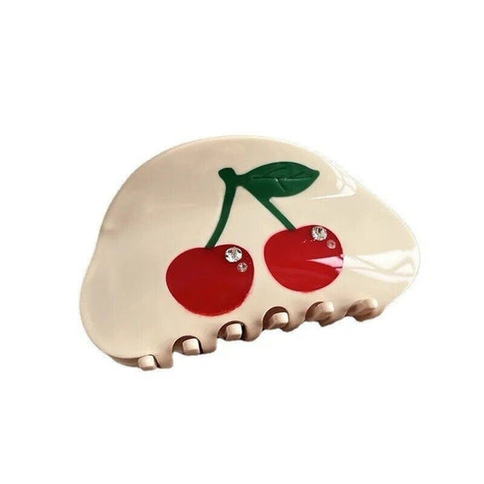 Off-white cherry rhinestone hair claw with red cherries, green leaves, and decorative teeth