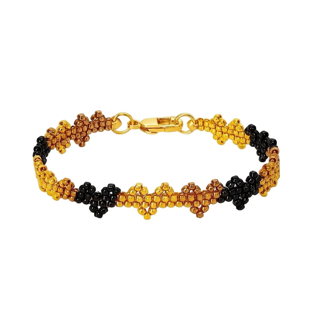 Beaded bracelet with gold, black, and brown heart pattern, gold clasp and ring
