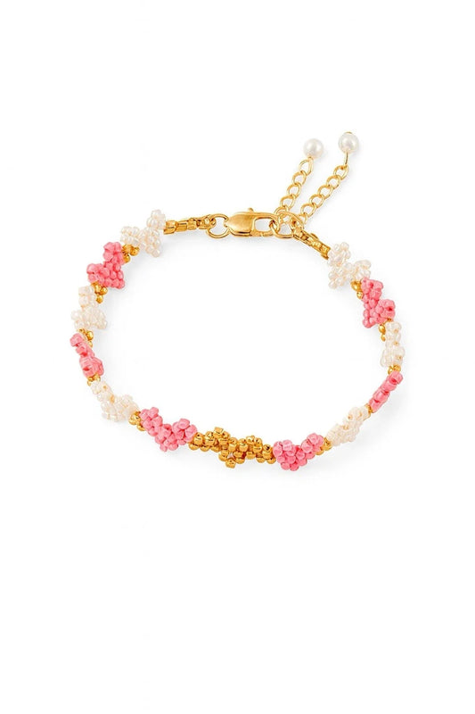 Pink and white beaded heart bracelet with gold clasp and chain extender