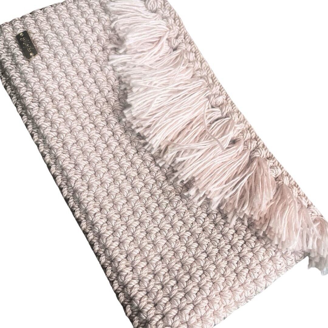 Handmade crochet clutch with tassel fringe and textured stitch panel, light pink