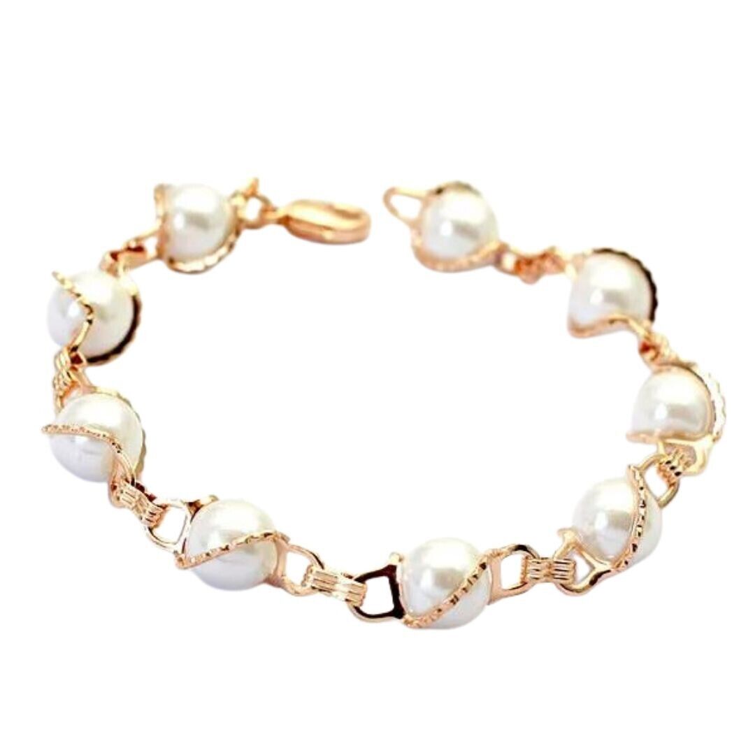 Gold link bracelet with white pearl-like oval beads