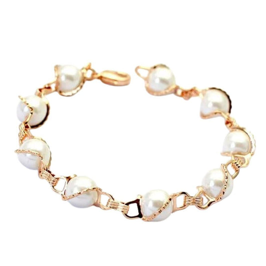 Gold link bracelet with white pearl-like oval beads