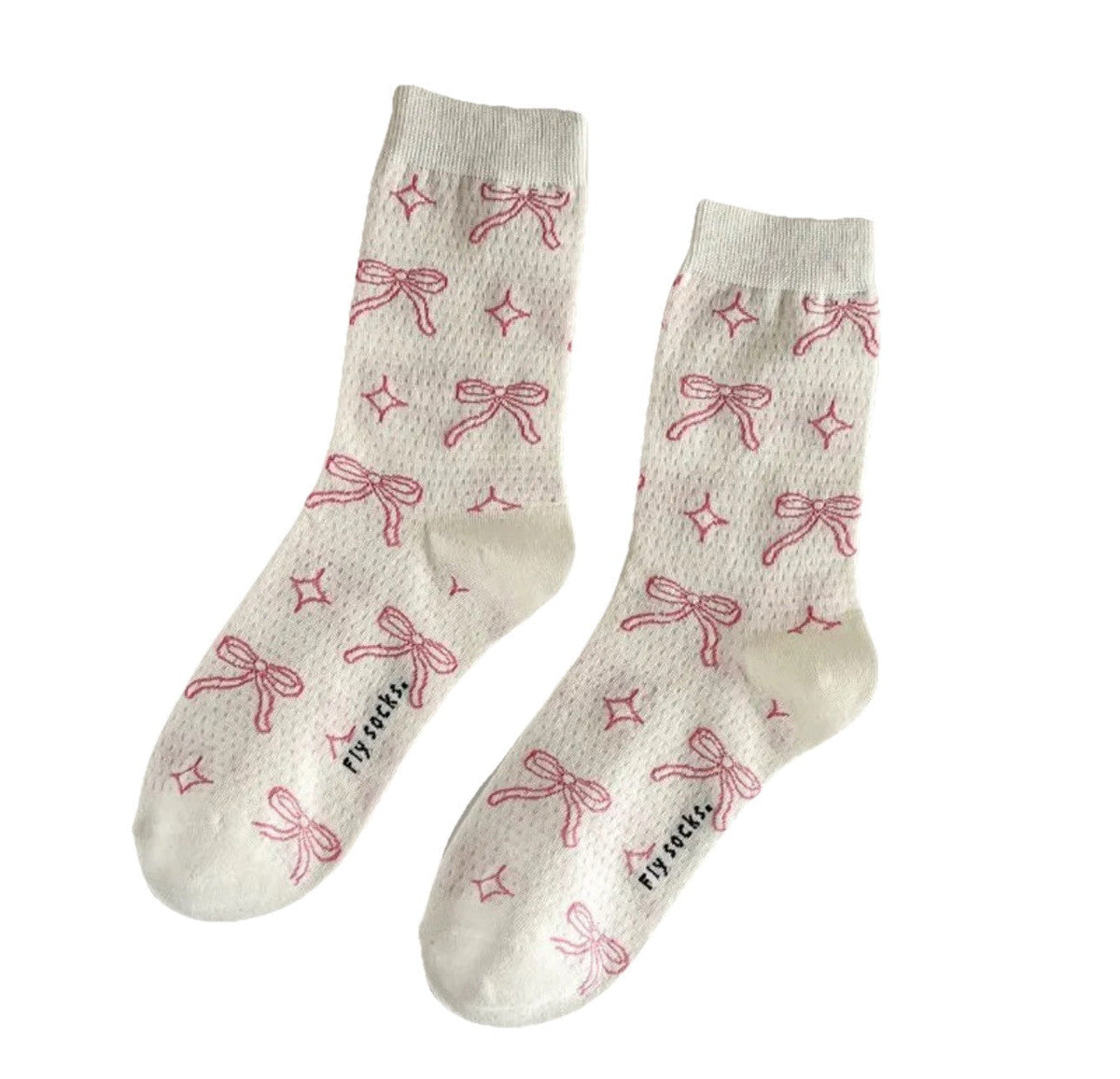 White mid-calf socks with pink bows and ribbon pattern