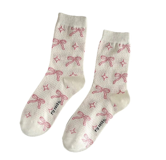 White mid-calf socks with pink bows and ribbon pattern