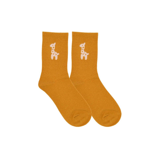 Mustard baby over-the-ankle socks with white giraffe print, pair