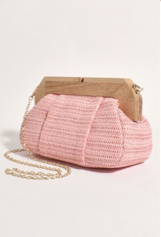 Pink woven frame clutch purse with timber handle and gold chain strap