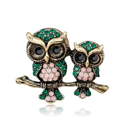 Rhinestone owl brooch: two gold-tone owls with green and pink crystals, dark eyes
