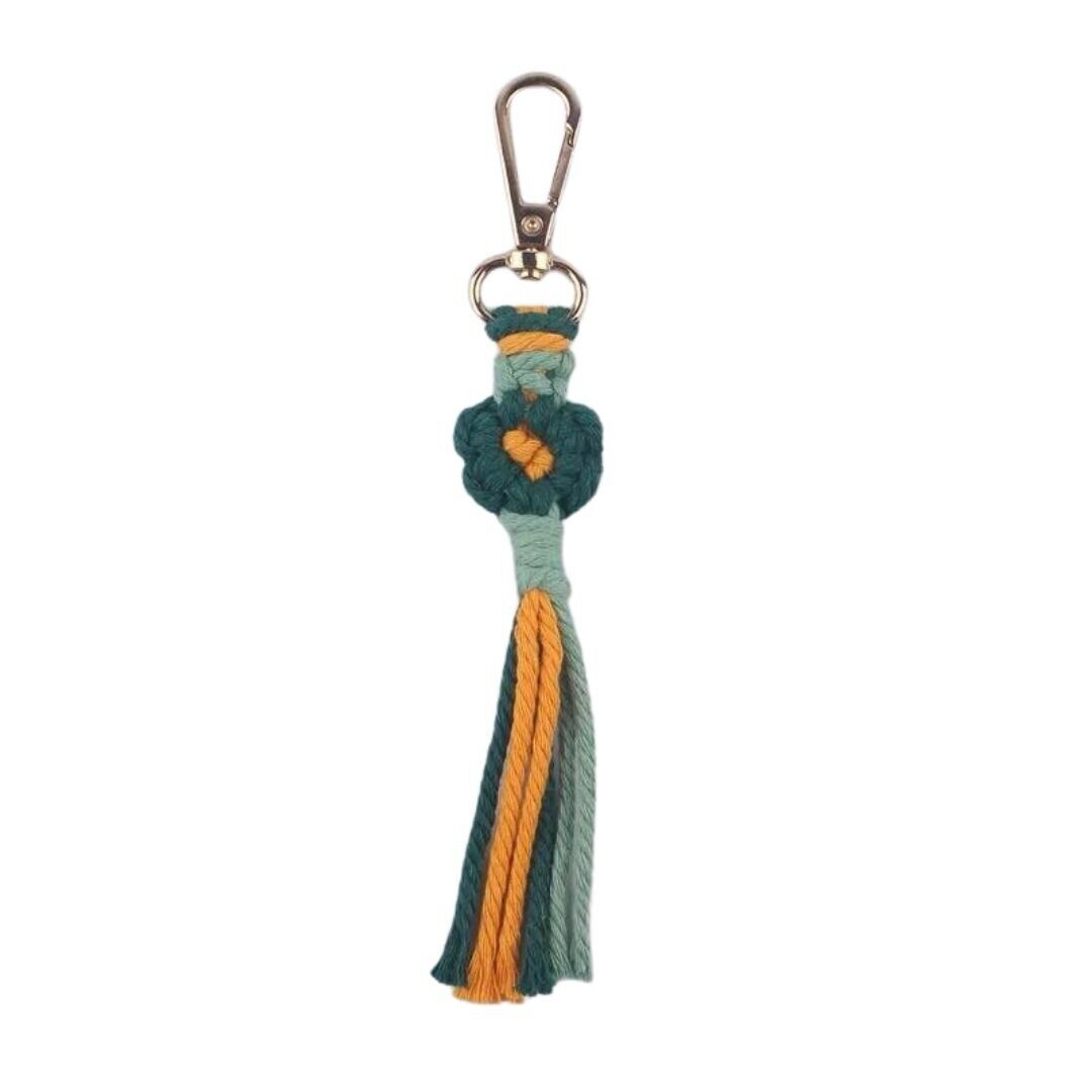 Crochet keychain with floral charm and hanging orange and teal tassel