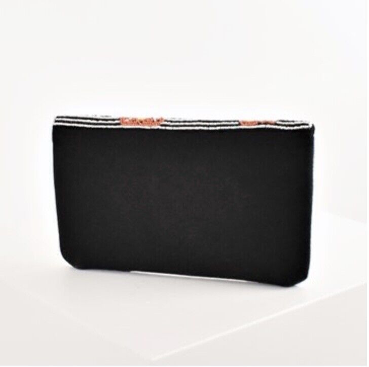 Black clutch purse with solid front panel and beaded top edge
