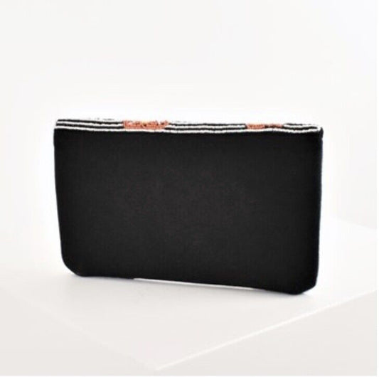 Black clutch purse with solid front panel and beaded top edge