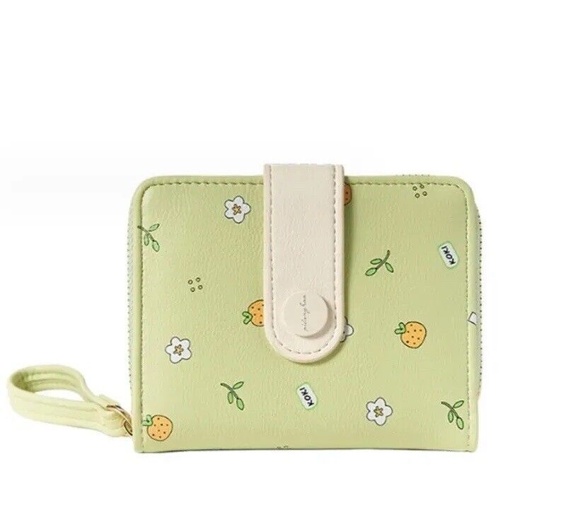 Pastel green mini zipper wristlet wallet with wrist strap and fruit-flower print