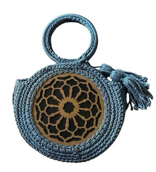 Teal blue handmade crochet bag with round wooden appliqué and tassel