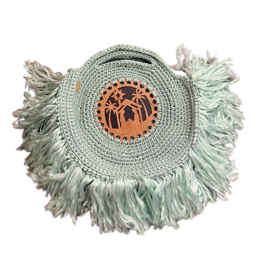 Blue handmade crochet bag with nativity carved wood appliqué and fringe