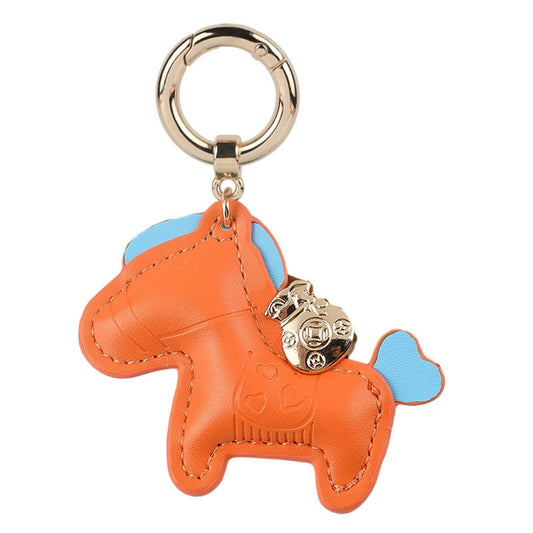 Orange faux leather pony bag charm keychain with blue accents and metal ring