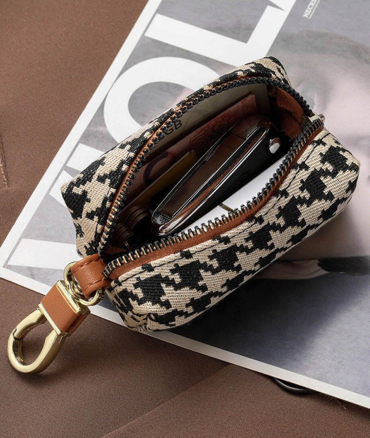 Houndstooth mini wallet keychain opened to show card slots, with key ring and zipper