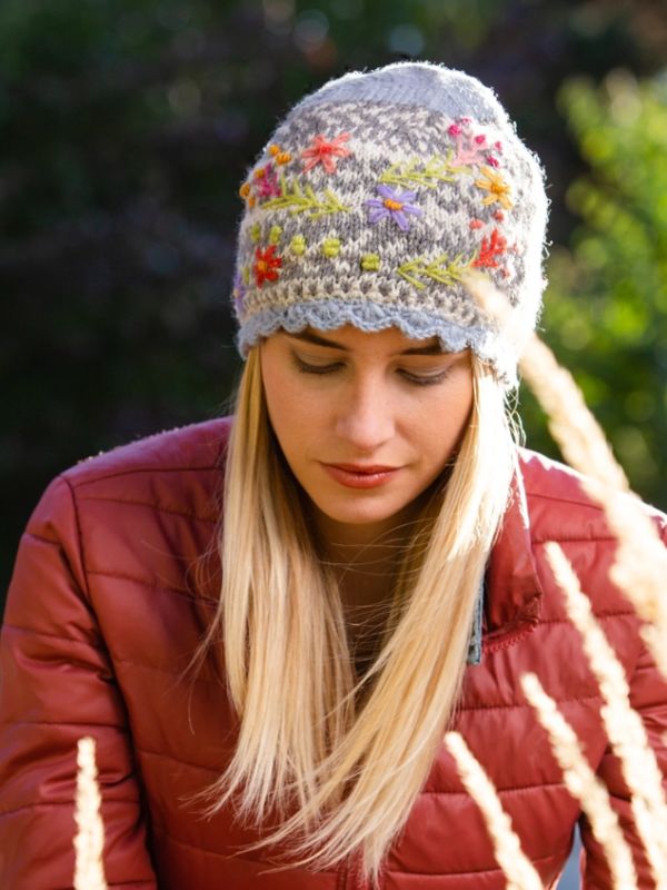 Heather gray wool knit hat with multicolor floral embroidery and ribbed cuff