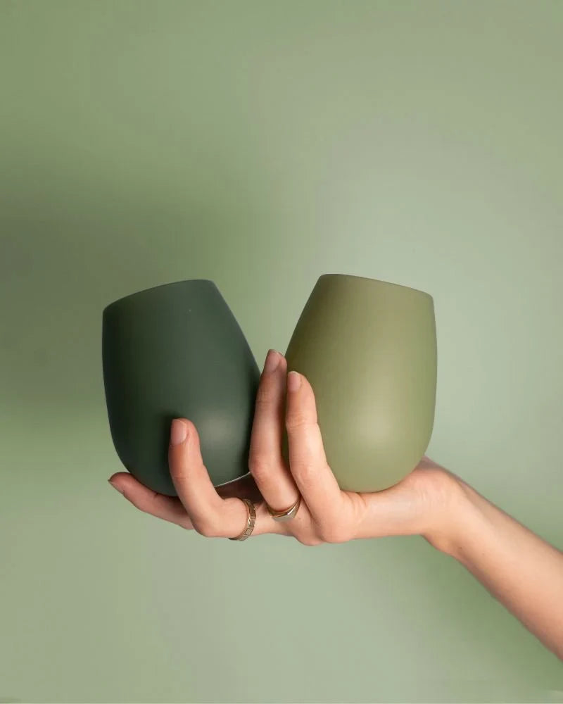 Green and light green stemless silicone wine glasses, two cups with rounded rim and no stem