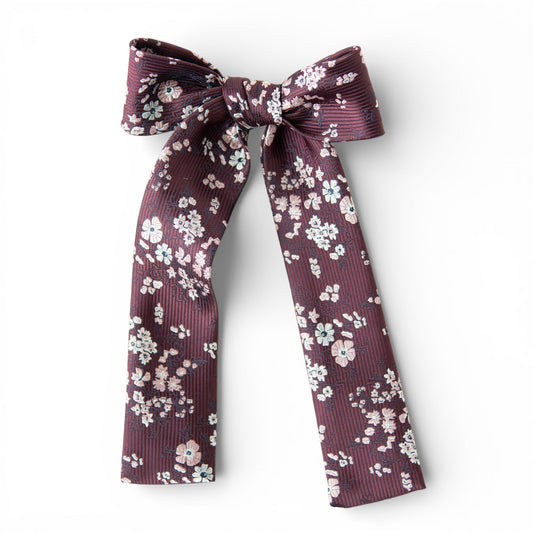 Burgundy floral lady hair bow with tied ribbon tails