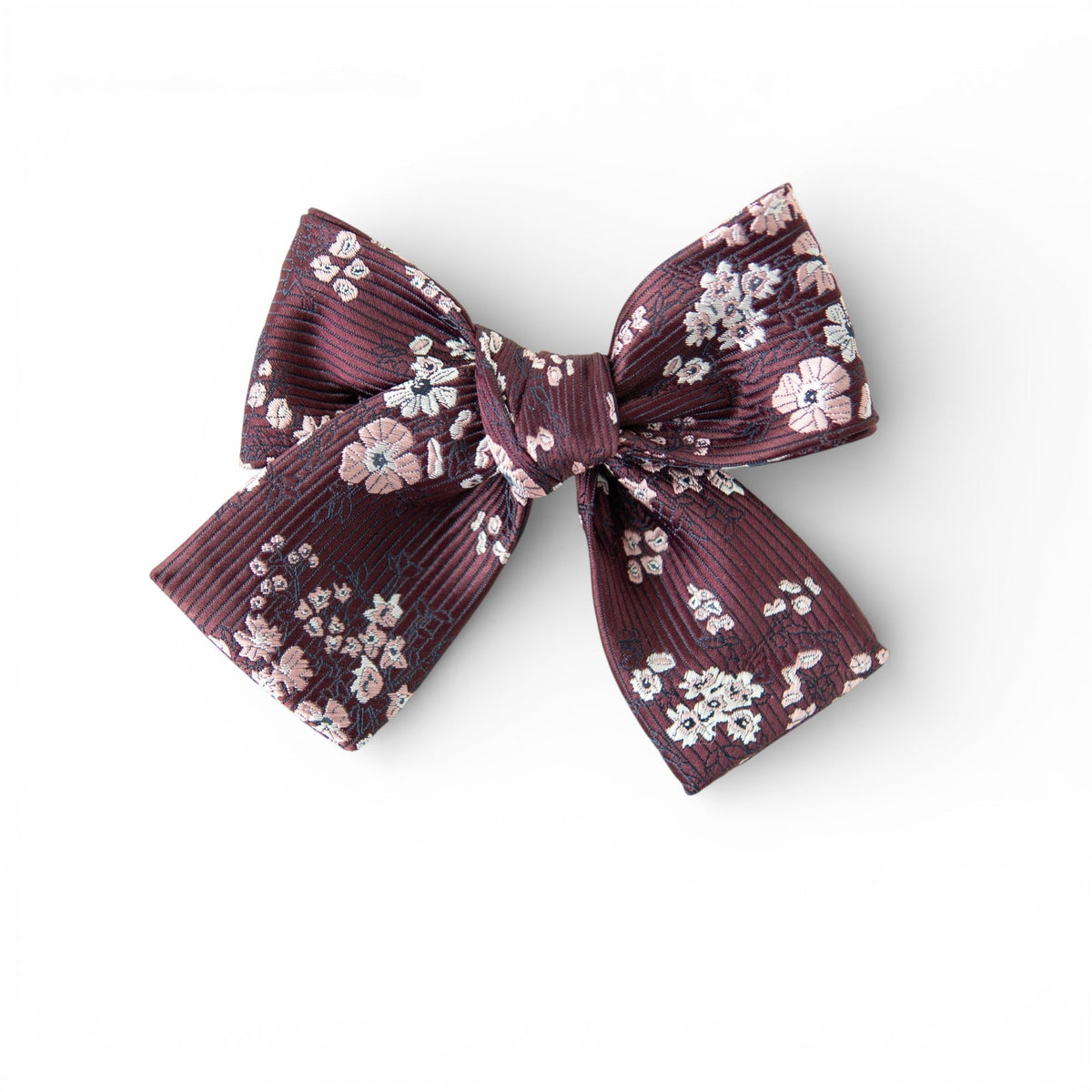 Petite hair bow in deep burgundy with small floral print and layered ribbon tails.